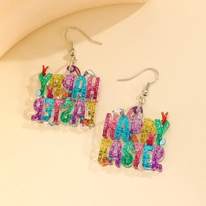 Close-up of Happy Easter acrylic earrings with bunny ears and carrot charms detail