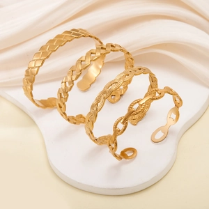 Dettagli di quattro bracciali rigidi in acciaio inossidabile dorato con texture