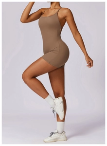 Side view of a backless tan athletic romper showcasing quick-dry fabric and slim fit