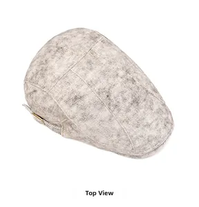 Top view of vintage gray washed denim ivy cap showing fabric texture and metal buckle
