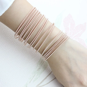 Rose gold multi-strand spring bracelet crafted from 1.7mm carbon steel wire