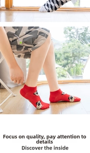Detail showing high-quality cotton red ankle socks featuring cute cartoon pug dog print