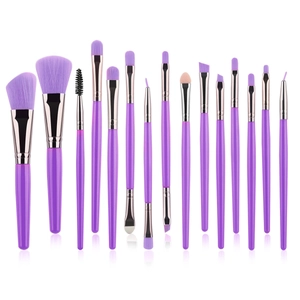 Detailed arrangement of 15 purple makeup brushes including powder and eye brushes