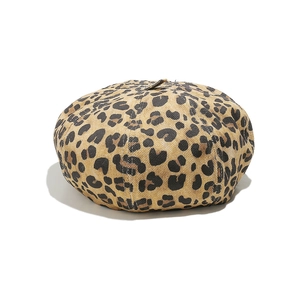 Close-up of leopard print beret showing detailed fabric texture and classic pattern
