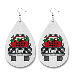 Detail of teardrop leather earrings with Teach Love Inspire print and truck pattern