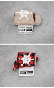 Detail shot of 22-inch Christmas stockings with snowflake applique on a digital scale