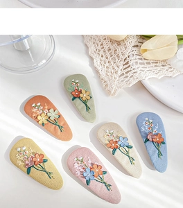 Set of six colorful embroidered fabric floral BB hair clips in teardrop shapes
