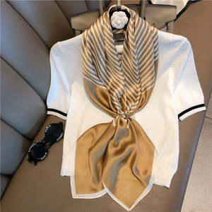 Minimalist gold and white striped silk square scarf styled with a pearl ring accessory