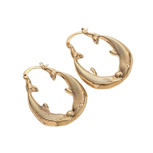 14K gold plated dolphin hoop earrings with ocean inspired design on white background