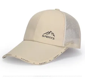 Detail view of beige mesh baseball cap with mountain logo and breathable fabric