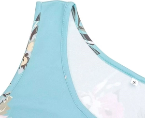 Detail of size S label on sleeveless maternity dress with blue floral pattern texture