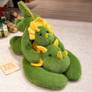 Cute green triceratops plush toy set in a warm home setting, soft dinosaur doll duo