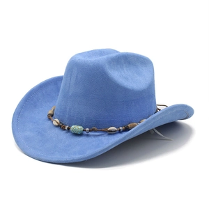 Detail of sky blue western cowboy hat featuring ethnic shell and turquoise bead trim