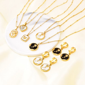 French palace style gold jewelry set with shell floral pendants and earrings