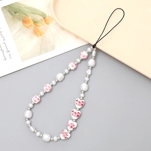 Floral pearl phone charm strap with pink heart beads and aesthetic tulip card display