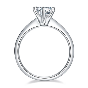 Detail of classic six-prong tiffany-style crown ring with one carat round cut zircon