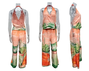 Detail of V-neck tie-up halter top and wide-leg trousers with landscape print