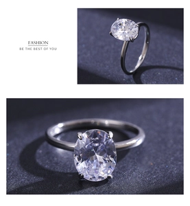 Macro shot of oval-cut zircon solitaire ring with classic four-prong setting and silver band
