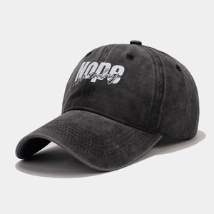 Detail of vintage washed black baseball cap with white NOPE not today printed text