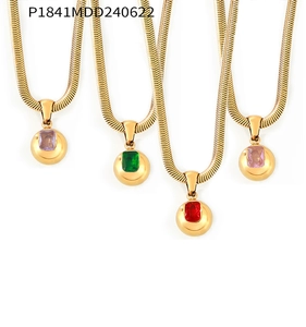 Detailed view of four golden snake chain necklaces with colorful zircon sphere pendants