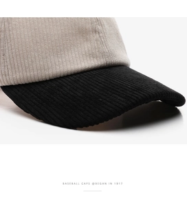 Detailed macro view of the contrast-color corduroy fabric on this baseball cap crown