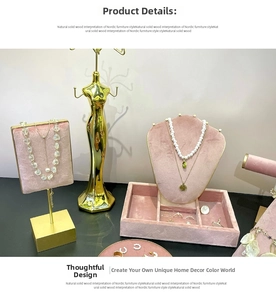 Detailed set of pink velvet jewelry displays and golden metal portrait hanger for necklace