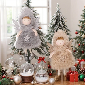 Plush Christmas angel ornaments with glitter wings and deer antlers in festive setting