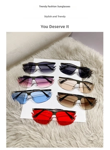 Detailed overhead view of multiple rimless flame-shaped sunglasses in vibrant colors