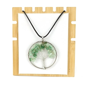 Handmade tree of life pendant necklace featuring green natural stones and silver wire wrap