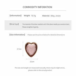 Detail view of heart-shaped zircon earrings with 13.7g weight and 2.7cm size info