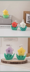 Detail of tulip shaped scented candles in various colors on a cozy decorative background