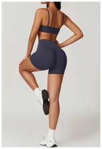 Detail of navy seamless sports bra and high-waisted scrunch butt lifting shorts set
