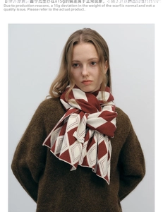 Close-up of red and white diamond pattern knit scarf on a model for winter warmth
