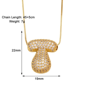 Detail view of gold letter pendant necklace with white zircon pavé and size measurements