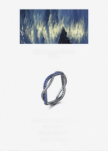Detail view of S925 silver double loop ring with blue pave zircons and black plating