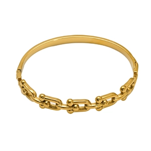 Bracciale moderno in acciaio al titanio placcato oro con maglie a U e zirconi cubici