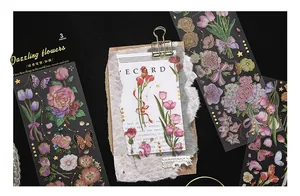 Detailed view of vintage gold foil floral PET stickers for journal decoration