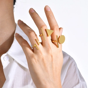 Minimalist gold stainless steel geometric rings set featuring circles and triangles