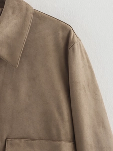 Detail of khaki faux suede jacket showing classic lapel and premium stitched texture