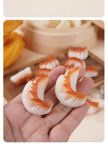 Macro shot of realistic PVC fried dumpling model showing texture and palm-sized dimensions