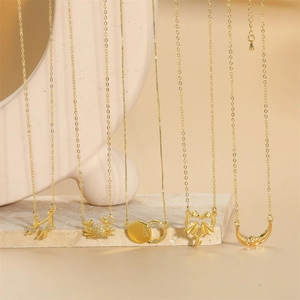 Set of five gold crab and moon pendants necklaces minimalist jewelry for women