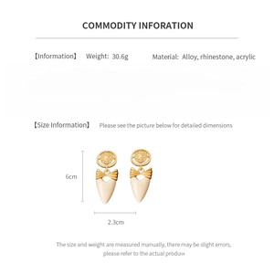 Size information and material detail of vintage bow heart earrings with rhinestones