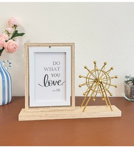 Detail of 4x6 rotating photo frame with a golden Ferris wheel model on a wood base