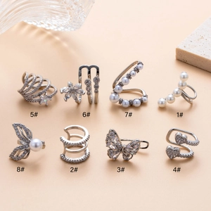 Collection of 8 minimalist silver butterfly ear cuffs with pearls and cubic zirconia