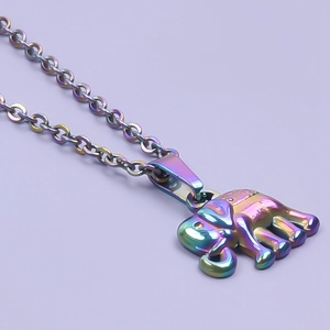 Close-up of rainbow-colored elephant pendant necklace with vibrant metallic finish
