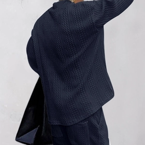 Detailed view of the dark blue waffle knit texture on a men's casual V-neck sweater set
