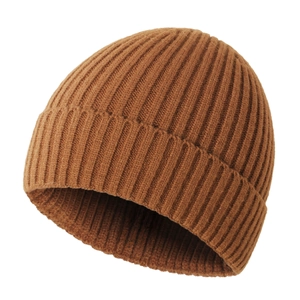 Close-up of caramel brown ribbed knit winter hat showing the textured fabric detail
