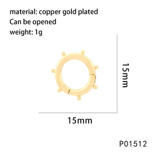 Macro detail of a 15mm gold-plated copper circular spring clasp with micro-set cubic zirconia