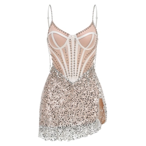 Detail of silver sequin mini dress featuring corset boning and chain straps