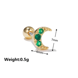 Macro shot of gold moon stud earring with green zircons and ball screw back, 7x6mm size